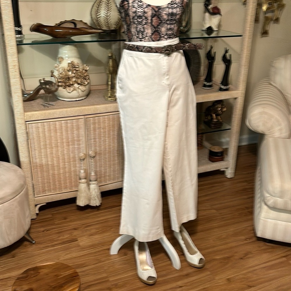 Is pair of wide leg pants and a sleeveless animal print bodysuit top